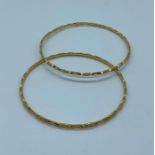 A pair of 22ct gold bracelets (16.2g)