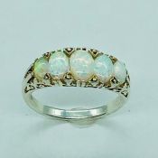 A silver and five stone opal ring