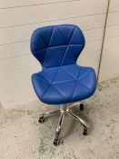 A blue faux leather swivel office style chair