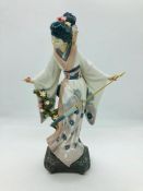 Lladro oriental lady with umbrella and holding cherry blossom