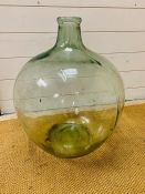 A large clear glass carboy