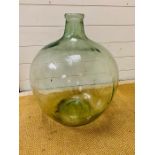 A large clear glass carboy