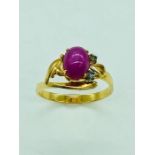 A 14ct yellow gold, star ruby and diamond ring.