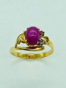 A 14ct yellow gold, star ruby and diamond ring.