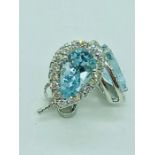 A pair of 18ct white gold pear shaped aquamarine and diamond earrings of 1.78cts