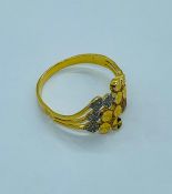 A 22ct three coloured gold ring