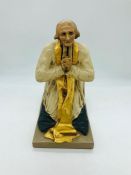 A statue of St John Vianney(Cure d'Ars), indistinct signature to side of base.