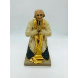 A statue of St John Vianney(Cure d'Ars), indistinct signature to side of base.
