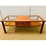 A G-Plan coffee table with glazed to the side and central drawer