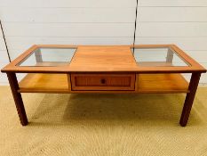 A G-Plan coffee table with glazed to the side and central drawer