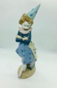 A lladro figure of a clown with a trumpet E-18