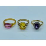 Three 9ct gold rings with a variety of stones