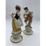 Two figurines one of Arlecchino and one of Columbina