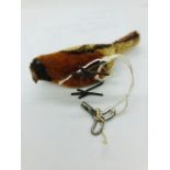 A Victorian wind up pecking bird