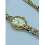 A ladies 9ct gold watch by Sovereign. (9.5g)