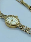 A ladies 9ct gold watch by Sovereign. (9.5g)