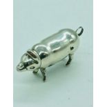 A silver vesta in the form of a pig
