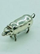 A silver vesta in the form of a pig