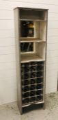 A cupboard with shelving and wine rack