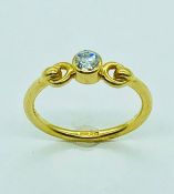 An 18ct yellow gold single stone diamond ring