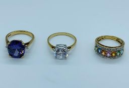 Three 9ct gold rings with a variety of stones and settings.