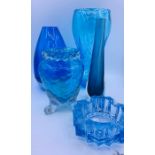 A selection of blue art glass of various shapes