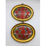 A collection of Antique wax seals in oval frames.