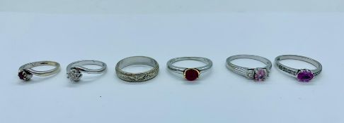 A selection of 9ct gold rings with a variety of settings, stones and styles.