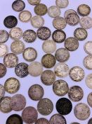 A selection of three pence coins, various years and conditions.