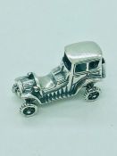 A sterling silver figure of a classic car