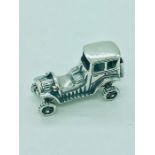 A sterling silver figure of a classic car