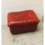 A mid century red leather pouffe