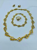 A 9ct yellow gold jewellery set to include necklace, bracelet, earrings and ring. (56.85g)