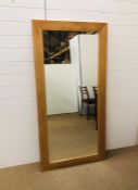 A large light oak mirror (155cm x 80cm)