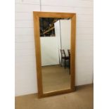 A large light oak mirror (155cm x 80cm)