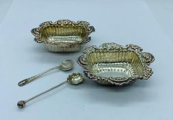 Two small silver salts with spoons.