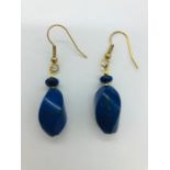 A pair of lapis lazuli and yellow metal drop earrings