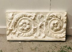 A plaster wall mounted decorative panel.