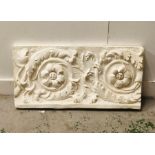 A plaster wall mounted decorative panel.