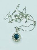 An 18ct white gold sapphire and diamond pendant necklace