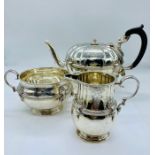A Hallmarked silver tea set, comprising tea pot, sugar bowl and milk jug, hallmarked 1924-25 (