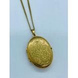 A 9ct yellow gold locket on 9ct chain