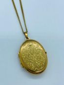 A 9ct yellow gold locket on 9ct chain