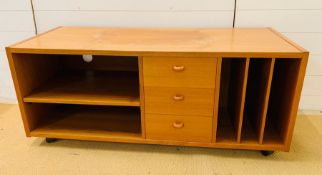 A teak style media unit