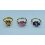 Three 9ct gold rings with a variety of stones to include citrine and amethyst.