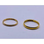 Two 22ct gold wedding rings. (3.9g)