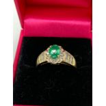 A 14ct yellow gold emerald and diamond cluster ring 2cts total approx.