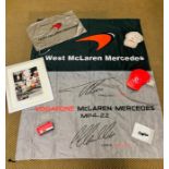 A selection of Mercedes McLaren promotional items to include three flags, two caps, a key ring,