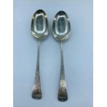 A Pair of Silver hallmarked serving spoons dated Sheffield 1901, makers mark CWF