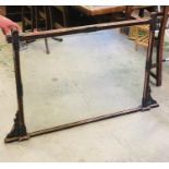 An over mantel black painted wooden mirror AF